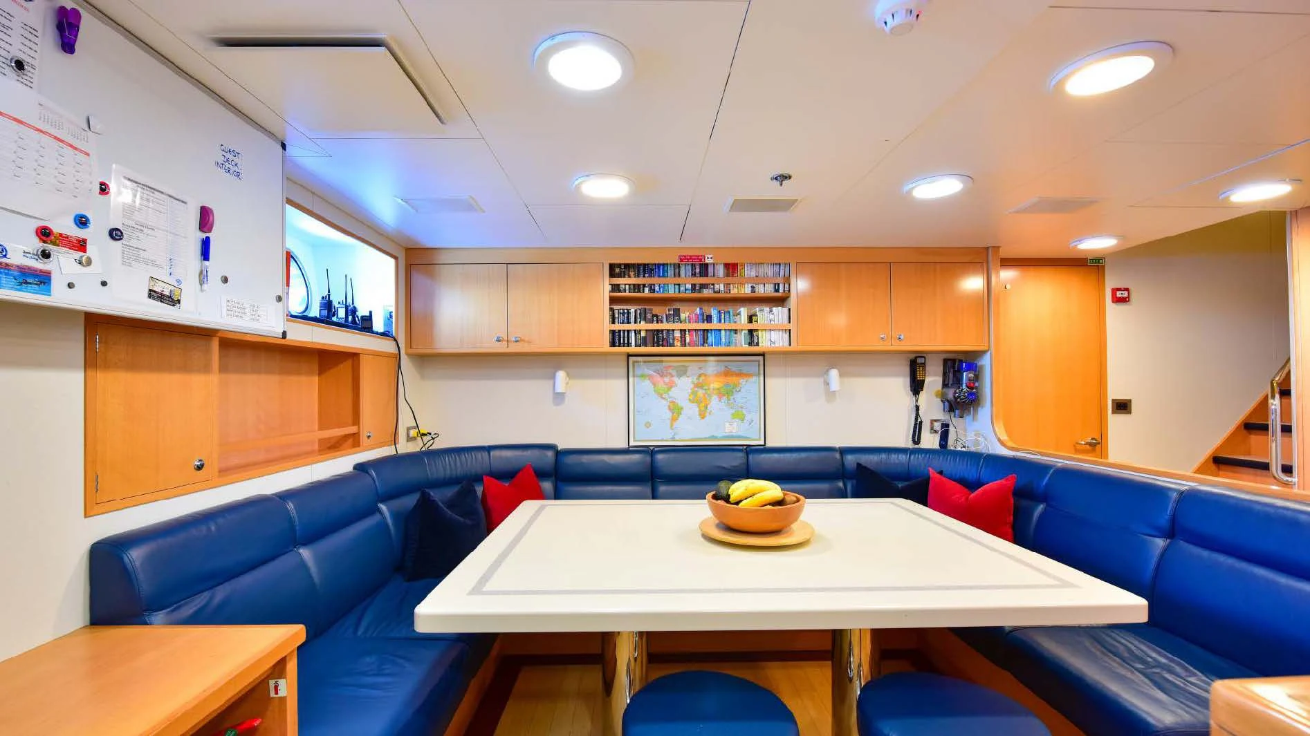 a room with a table and chairs aboard HALCYON Yacht for Sale