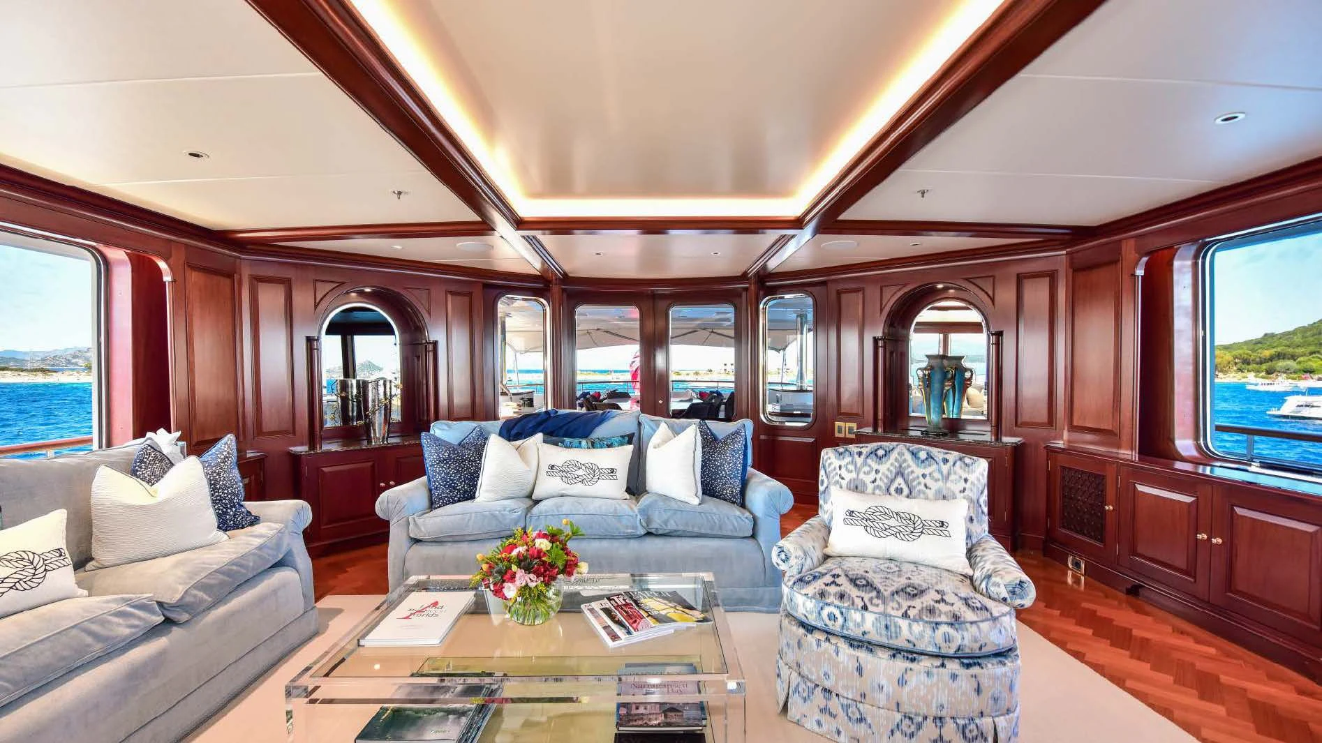 a living room with a large window aboard HALCYON Yacht for Sale