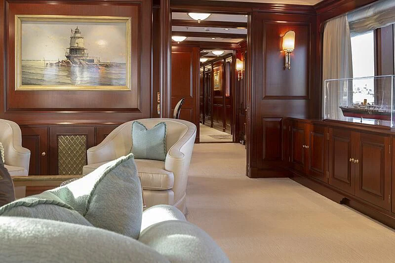 a living room with a couch and a television aboard HALCYON Yacht for Sale