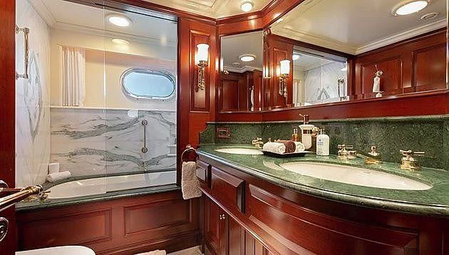 a bathroom with a large mirror aboard HALCYON Yacht for Sale