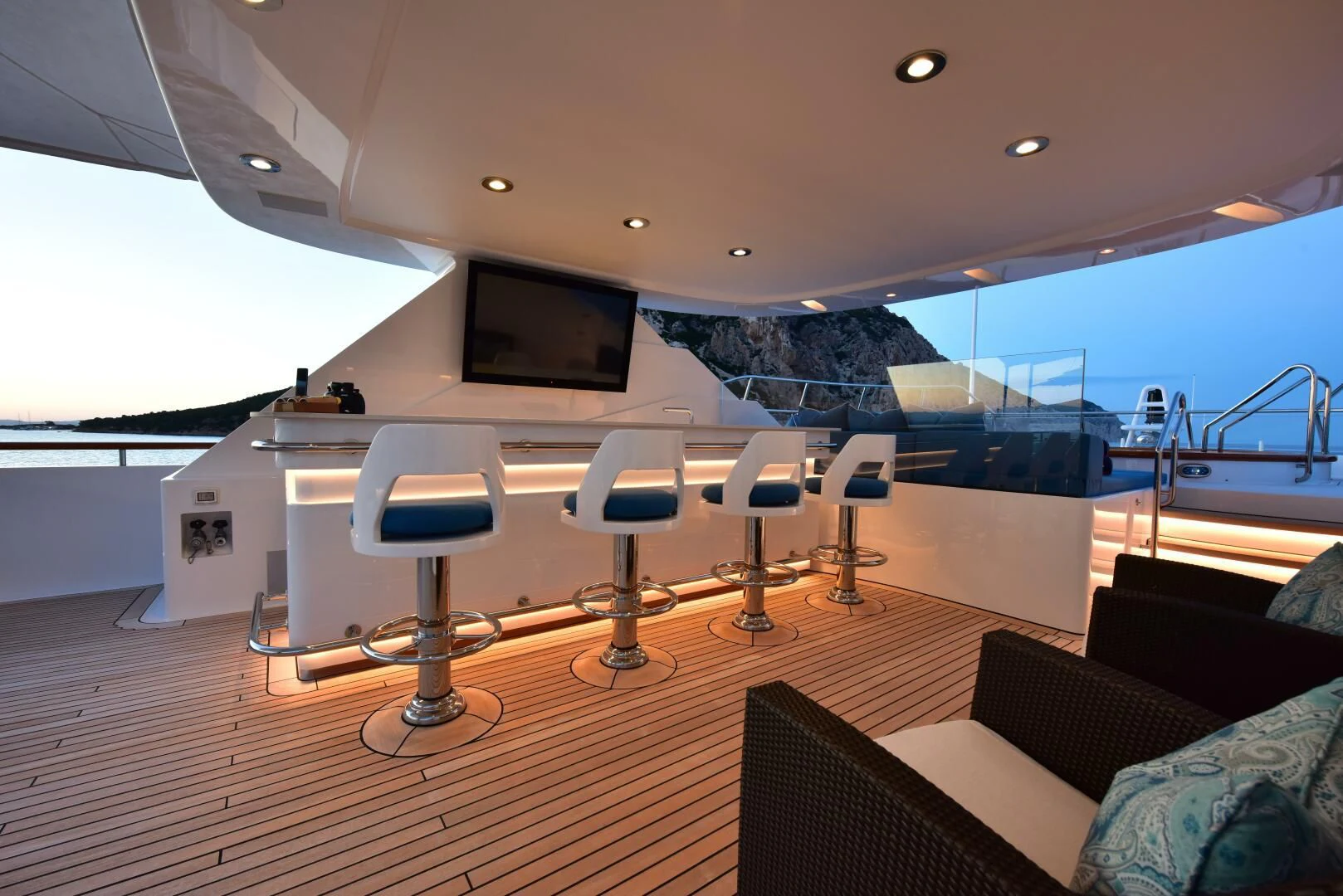 a room with chairs and a tv aboard HALCYON Yacht for Sale