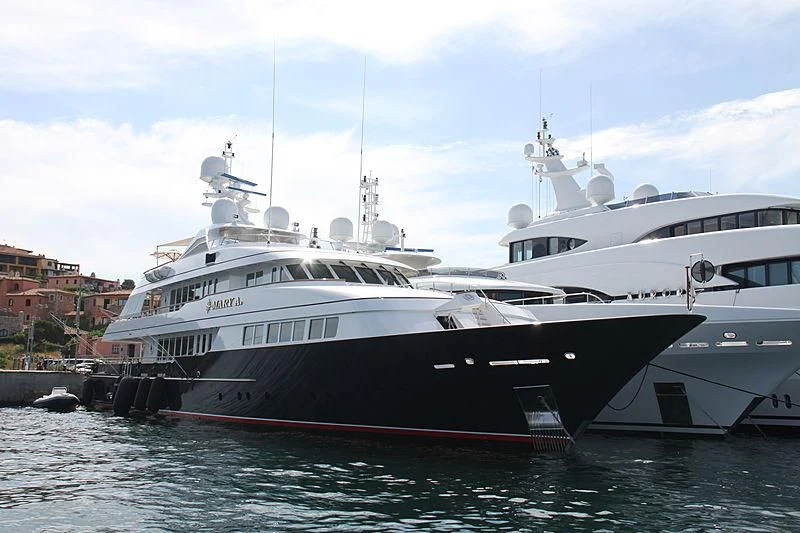 a couple of large boats in a harbor aboard HALCYON Yacht for Sale