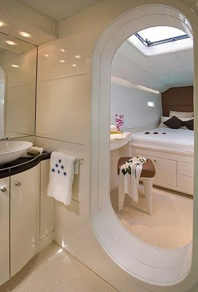 a bathroom with a large mirror aboard MAGIC CAT Yacht for Sale