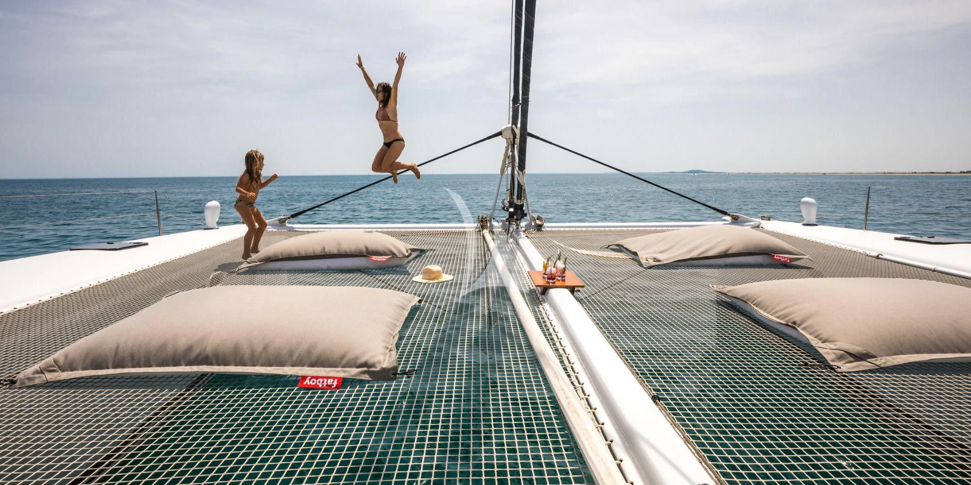 a person standing on a boat aboard MAGIC CAT Yacht for Sale