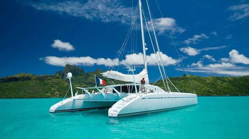 a white boat in the water aboard MAGIC CAT Yacht for Sale