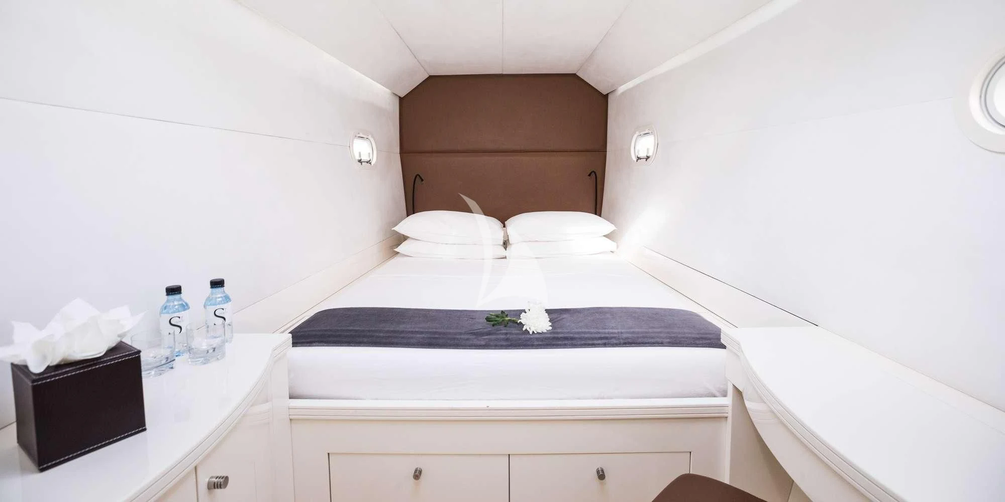 a bed with white sheets aboard MAGIC CAT Yacht for Sale