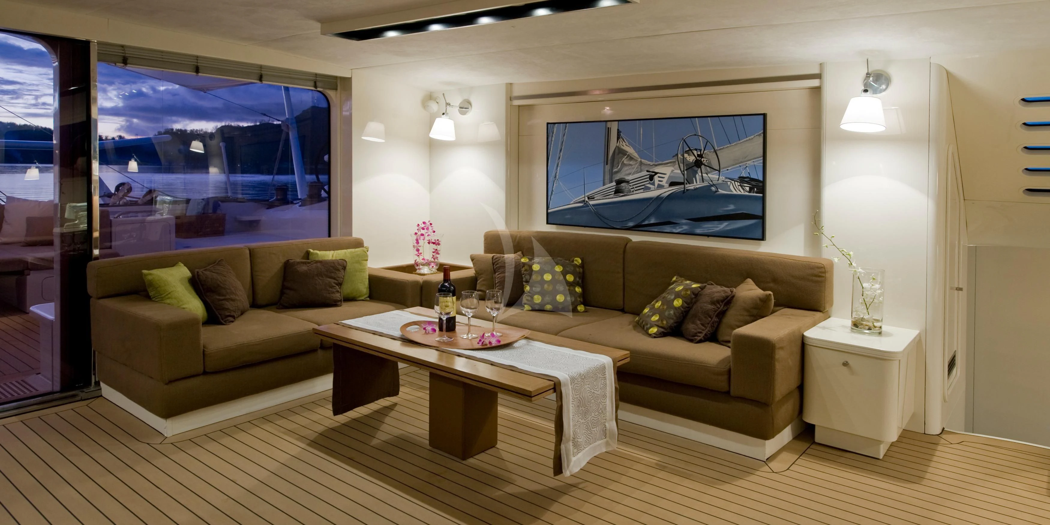 a living room with a couch and a table aboard MAGIC CAT Yacht for Sale