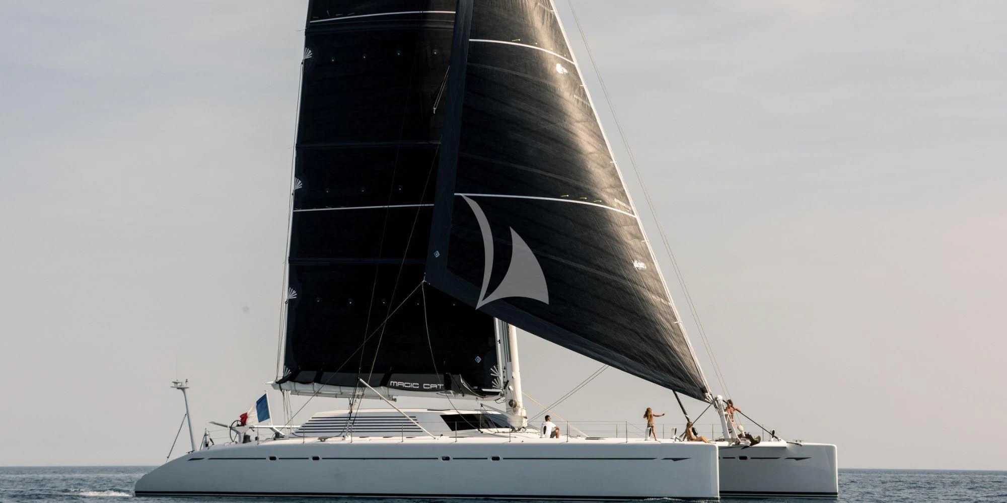 a boat with a sail aboard MAGIC CAT Yacht for Sale