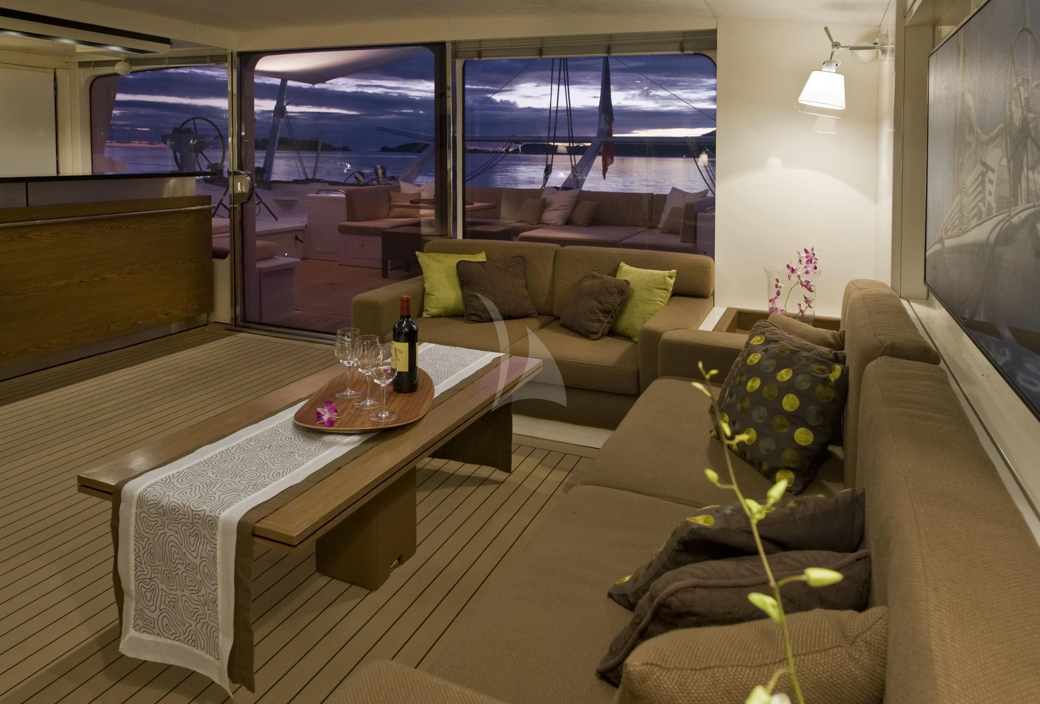 a room with couches and a table aboard MAGIC CAT Yacht for Sale