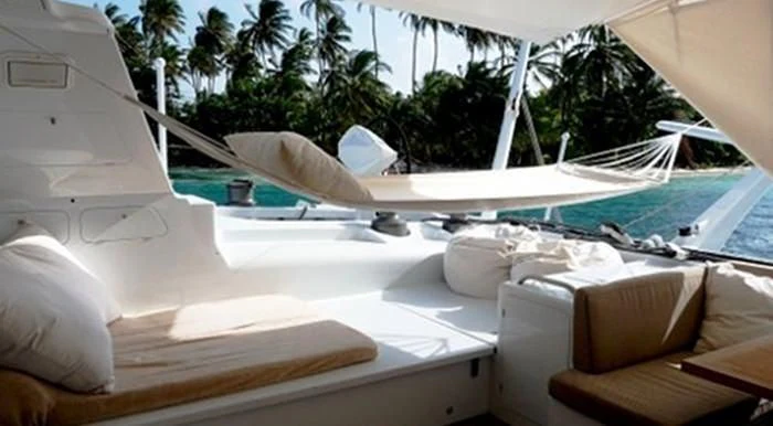 a boat with a person's face on the side aboard MAGIC CAT Yacht for Sale
