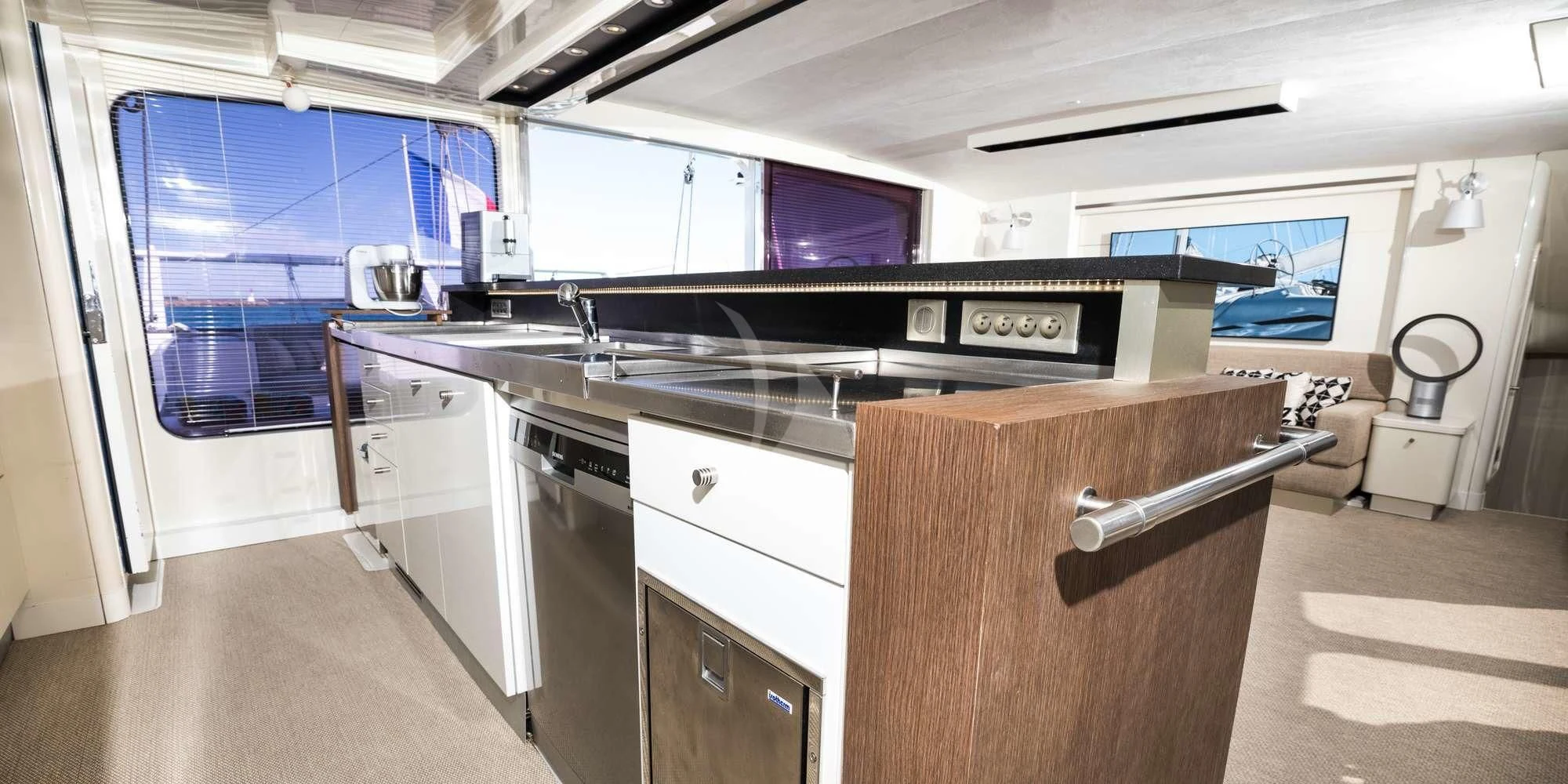 a kitchen with a stove and cabinets aboard MAGIC CAT Yacht for Sale