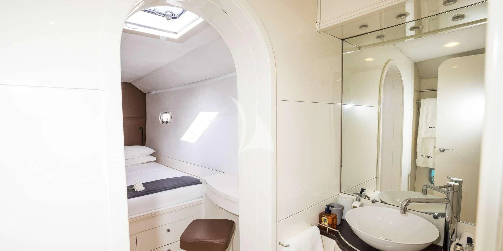 a bathroom with a sink and a mirror aboard MAGIC CAT Yacht for Sale