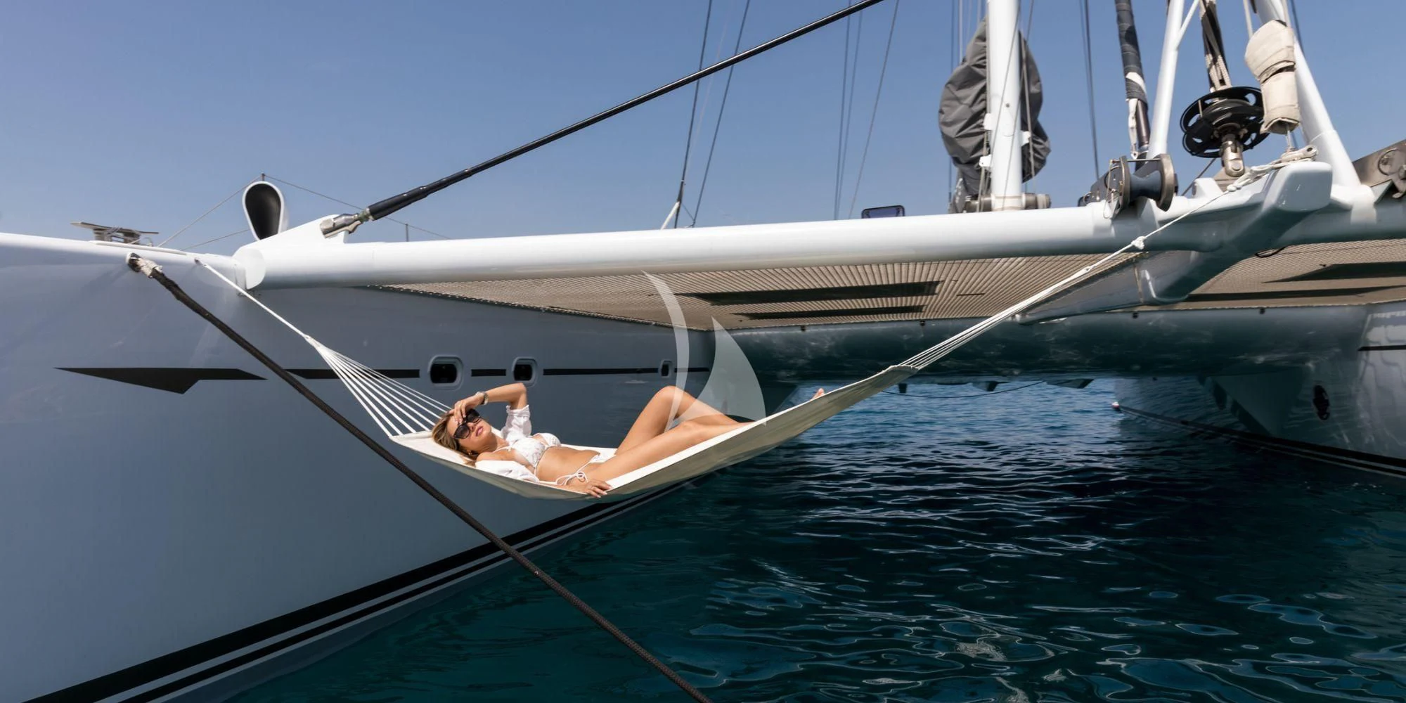 a man and woman on a sailboat aboard MAGIC CAT Yacht for Sale