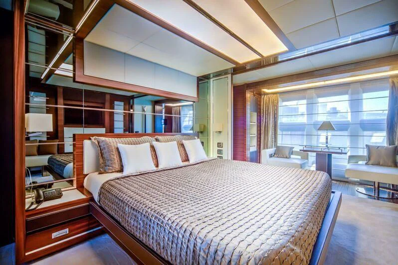 a bedroom with a large bed aboard YUZHOU Yacht for Sale