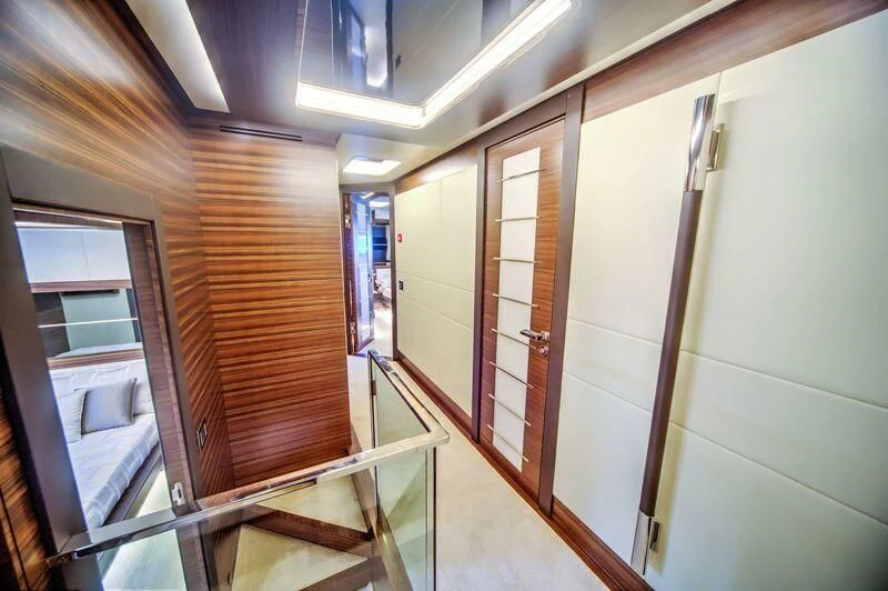 a hallway with glass doors aboard YUZHOU Yacht for Sale