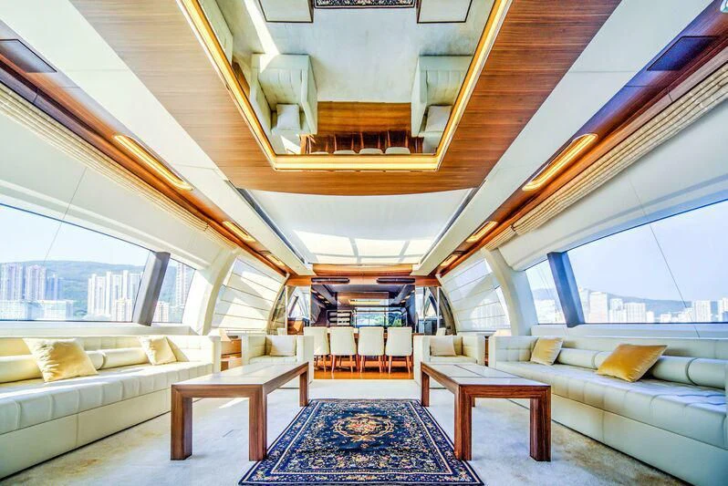 a room with a couch and a table aboard YUZHOU Yacht for Sale