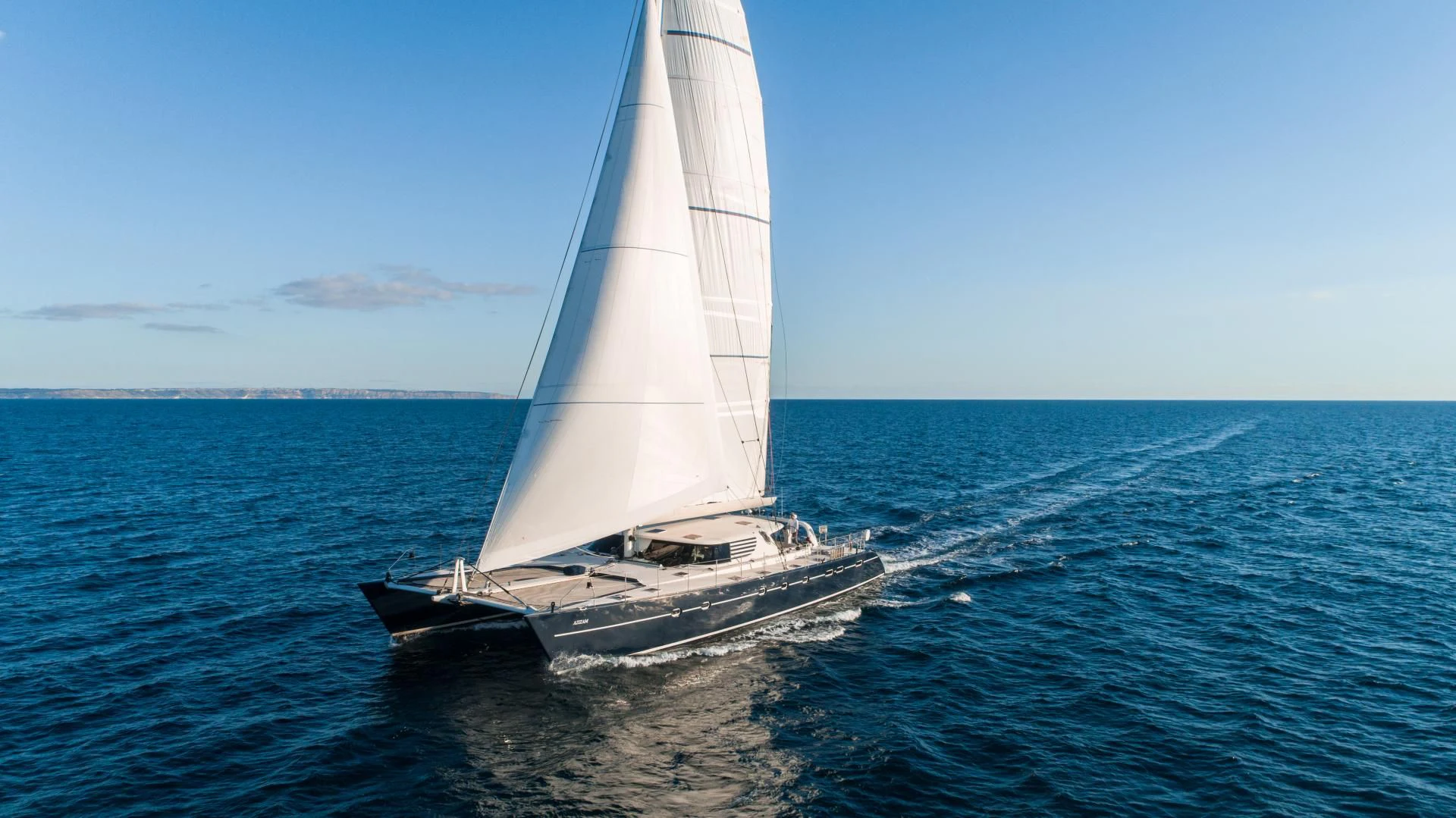 a white sailboat on the water aboard MIROVIA Yacht for Charter