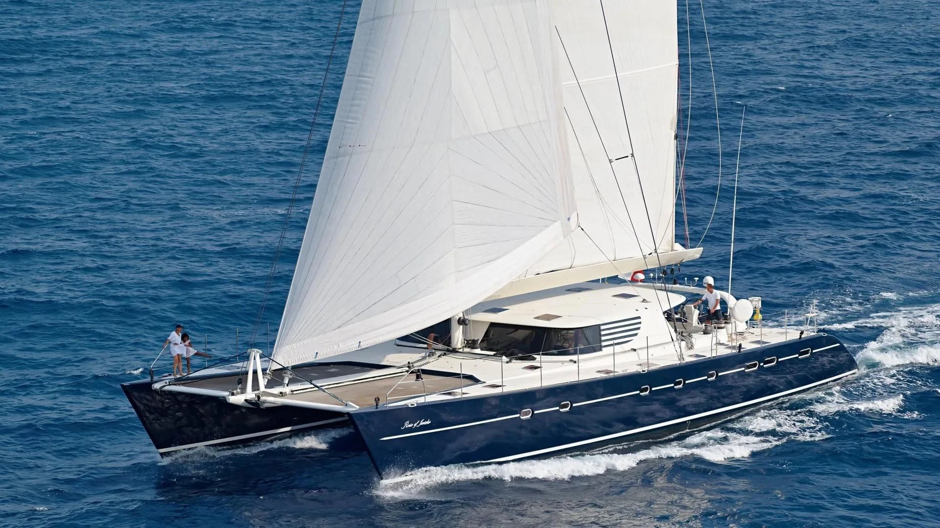 a white boat with people on it aboard MIROVIA Yacht for Charter