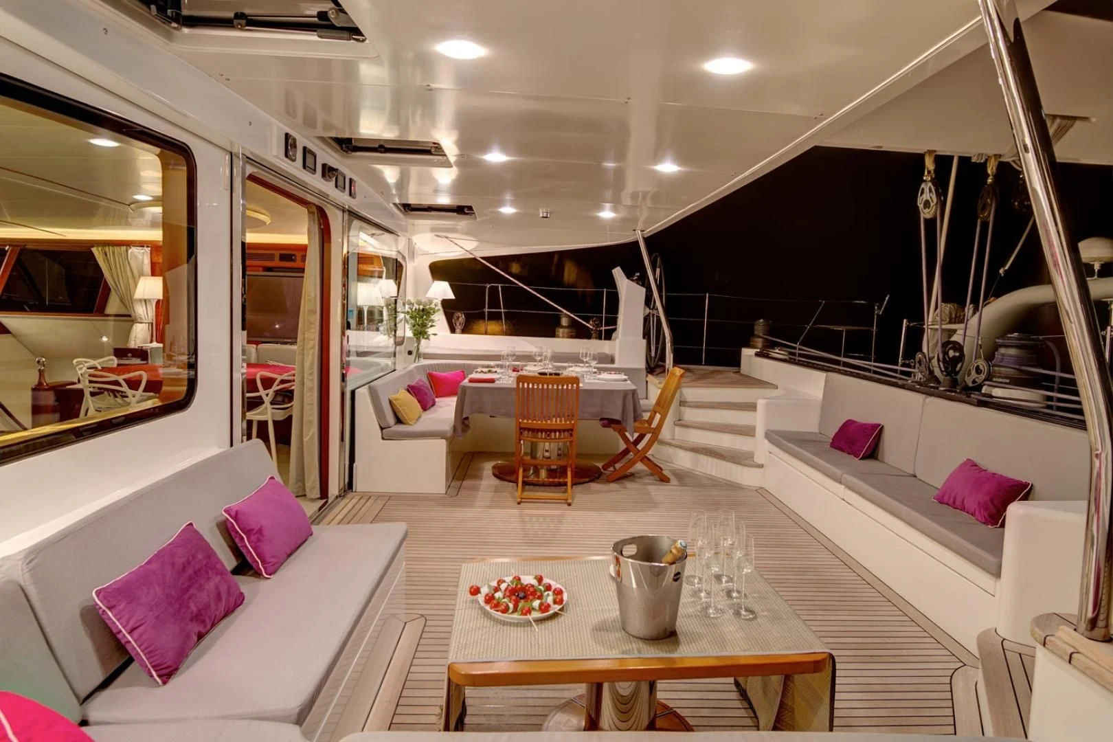 a living room with a table and couches aboard MIROVIA Yacht for Charter