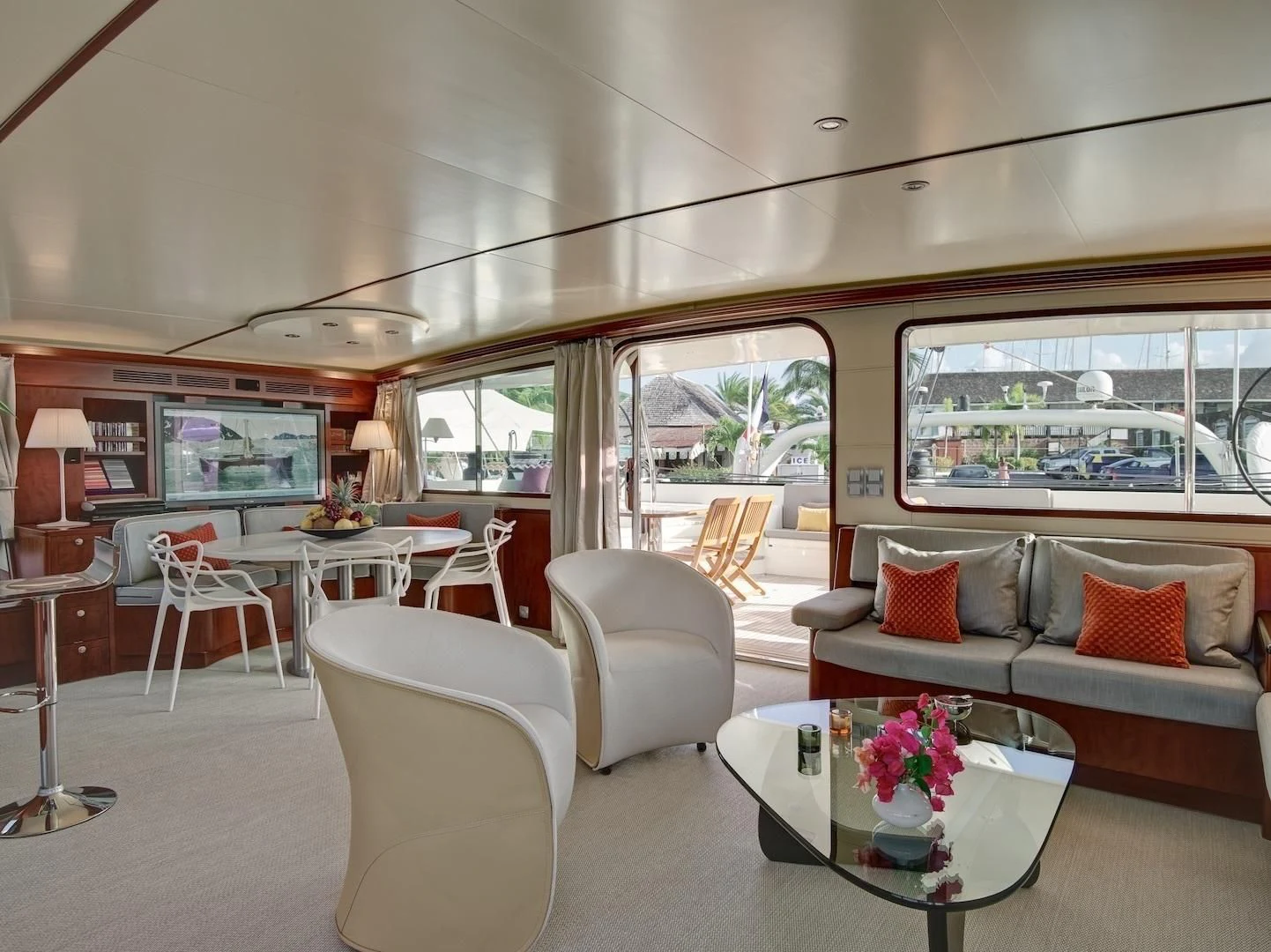 a living room with a large window aboard MIROVIA Yacht for Charter