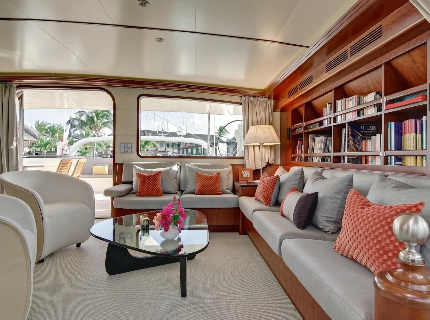 a living room with a bookcase aboard MIROVIA Yacht for Charter