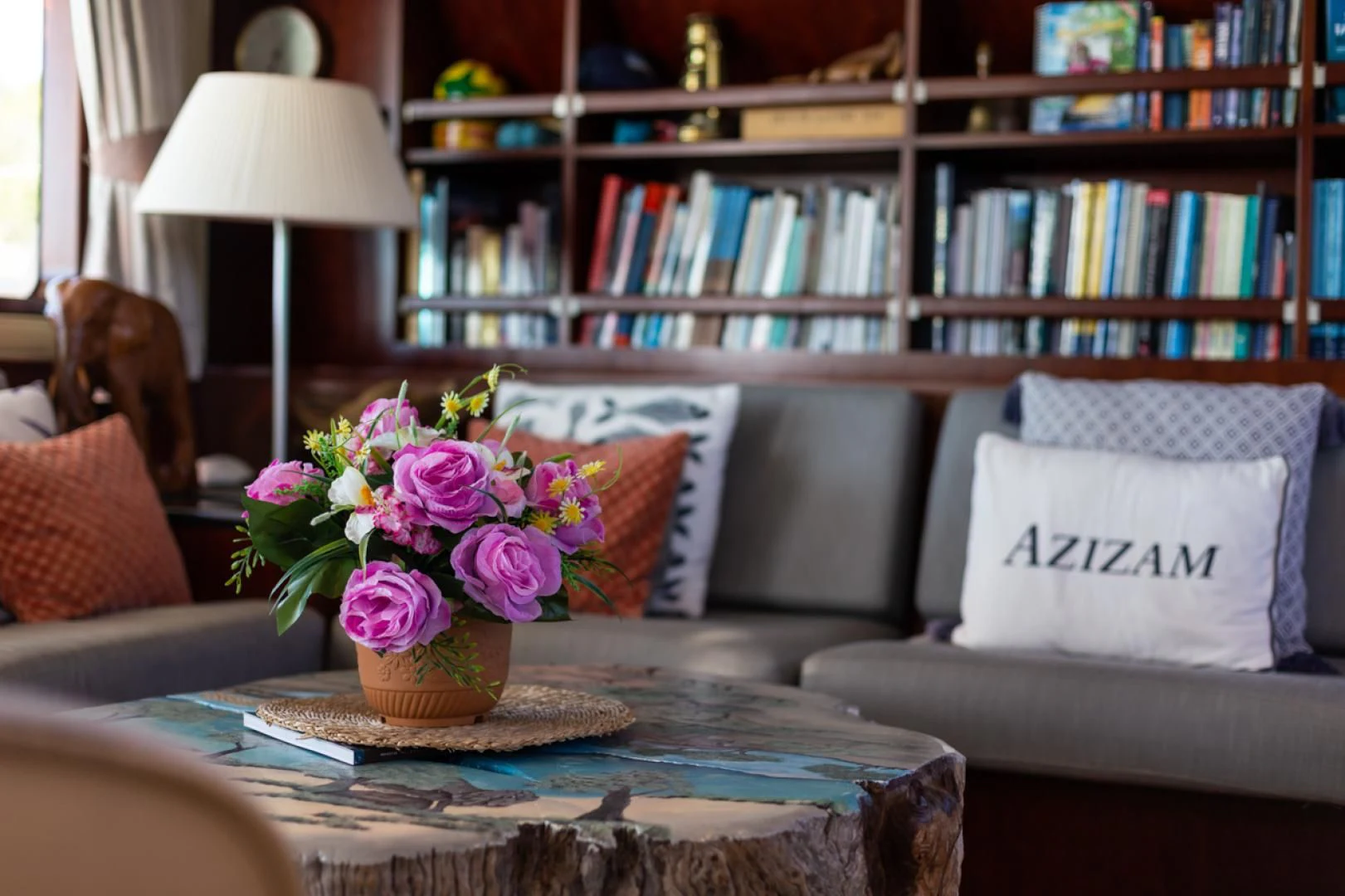 a vase of flowers on a table aboard MIROVIA Yacht for Charter