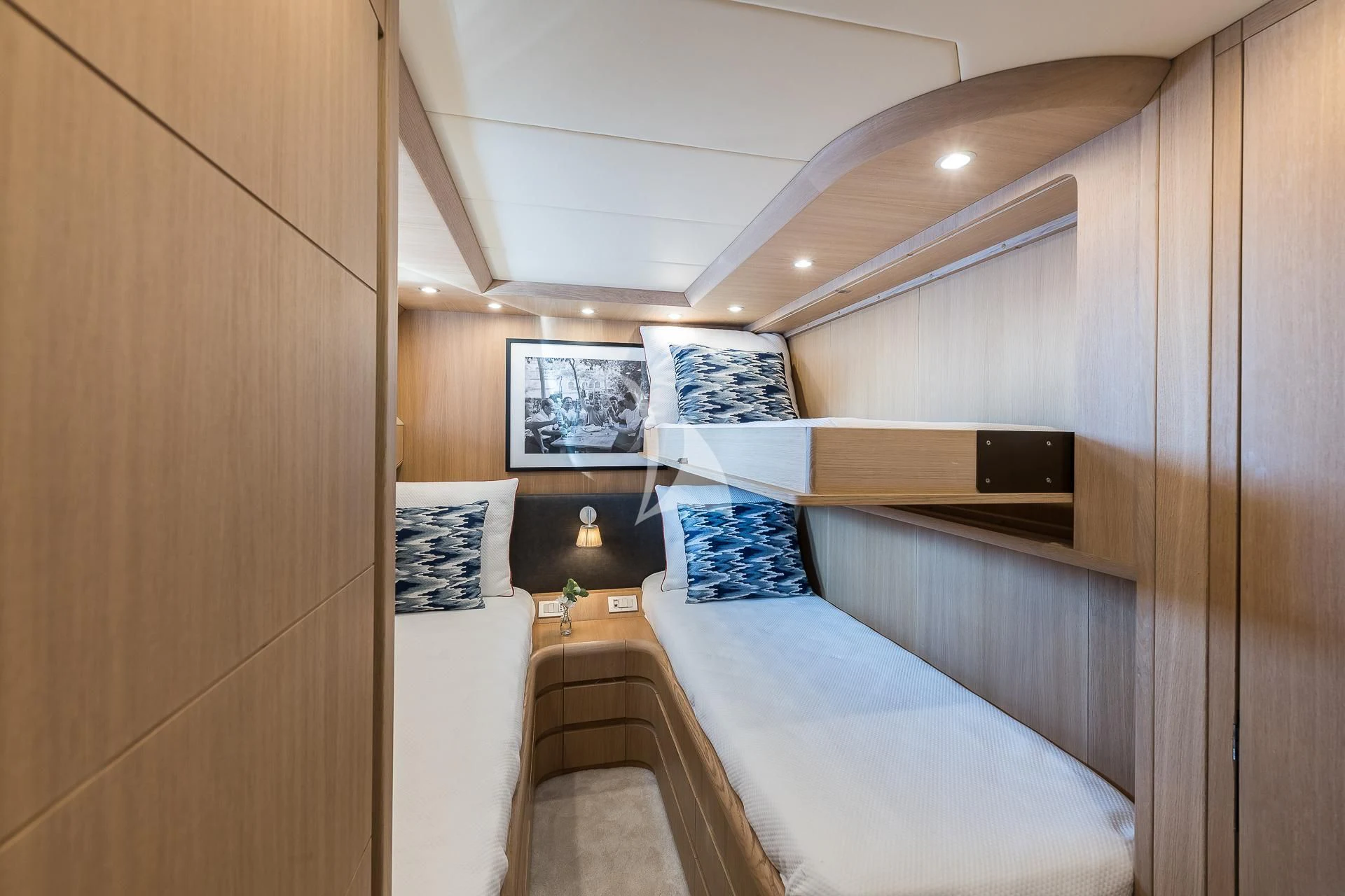 a room with a bed and a television aboard POBEDY I Yacht for Sale