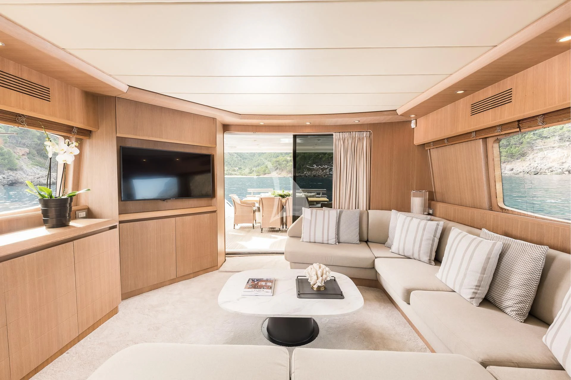 a living room with a large window aboard POBEDY I Yacht for Sale