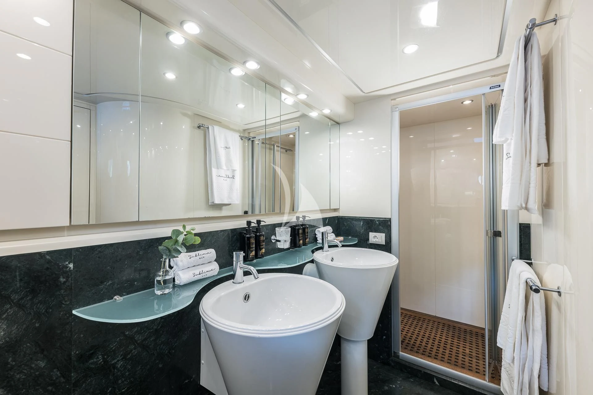 a bathroom with a sink and a mirror aboard POBEDY I Yacht for Sale