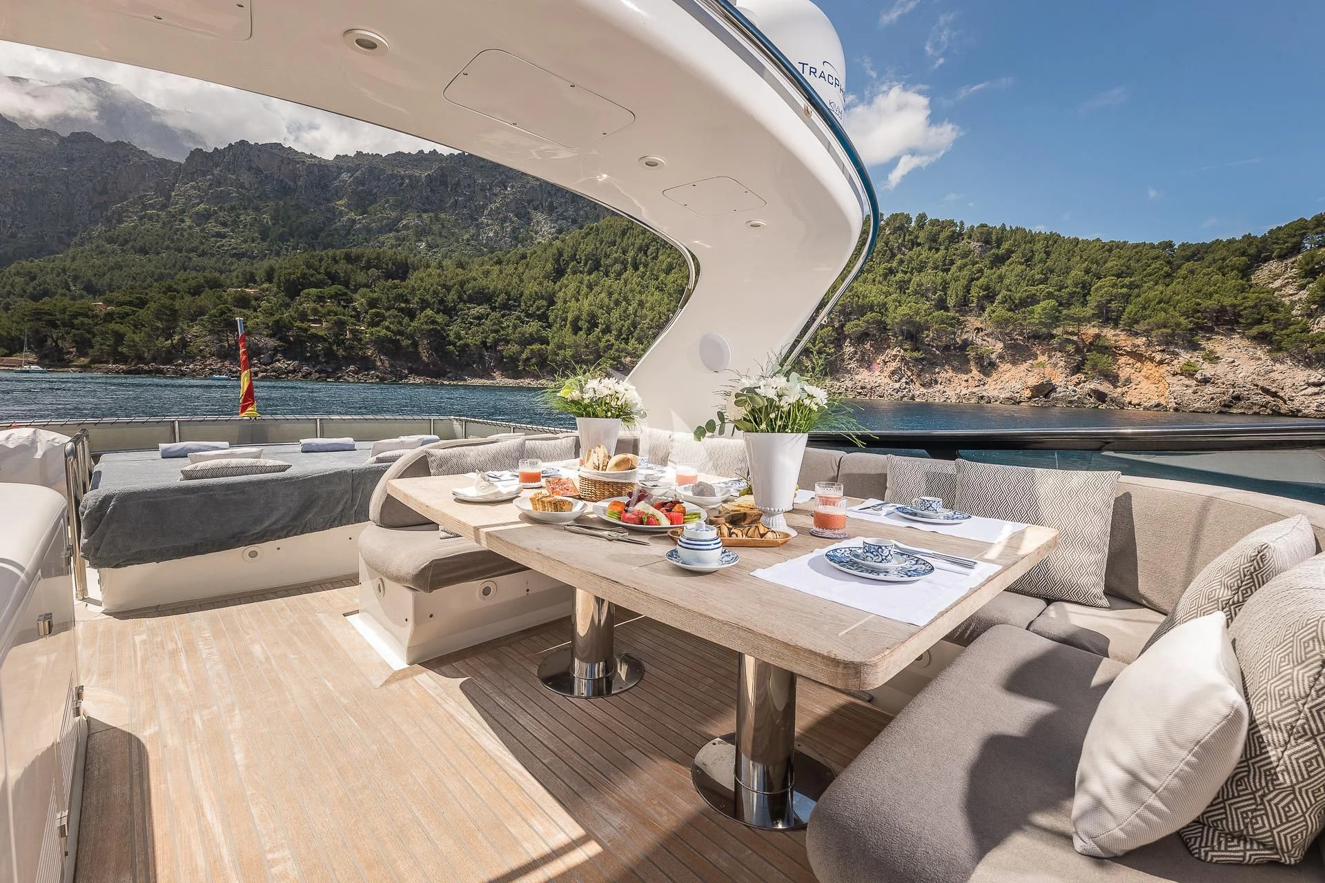 a table on a deck aboard POBEDY I Yacht for Sale
