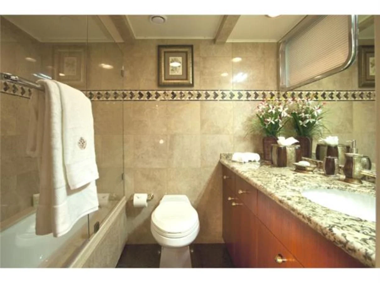 a bathroom with a sink toilet and bathtub aboard SHENANDOAH Yacht for Sale