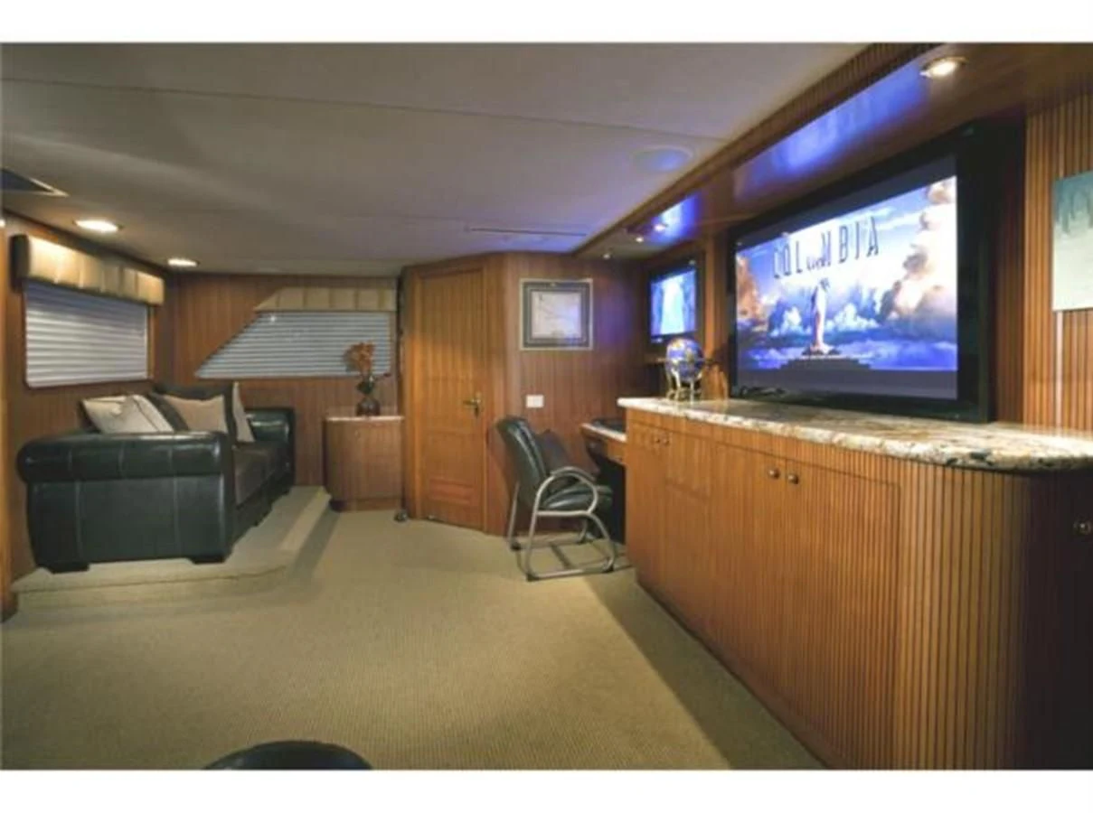 a living room with a tv aboard SHENANDOAH Yacht for Sale