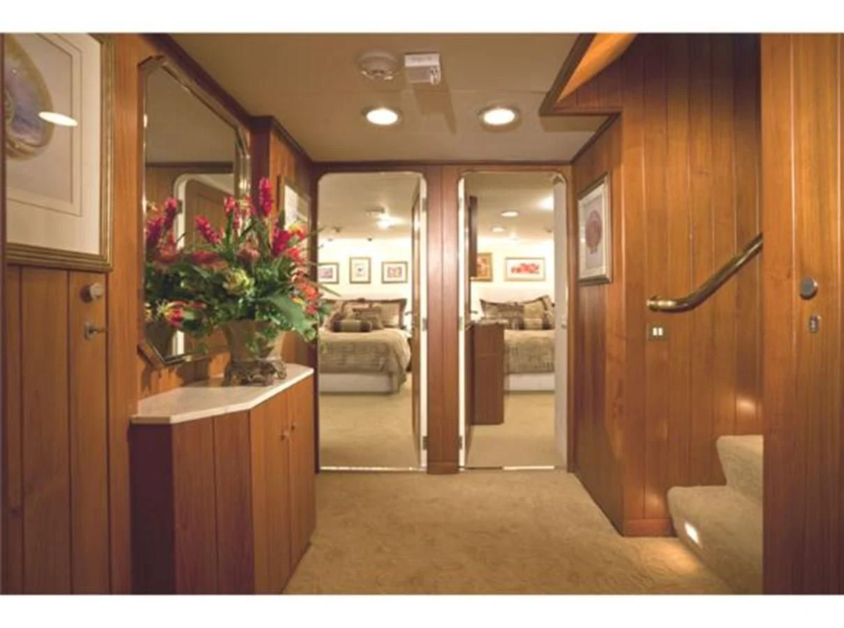 a room with a mirror and furniture aboard SHENANDOAH Yacht for Sale