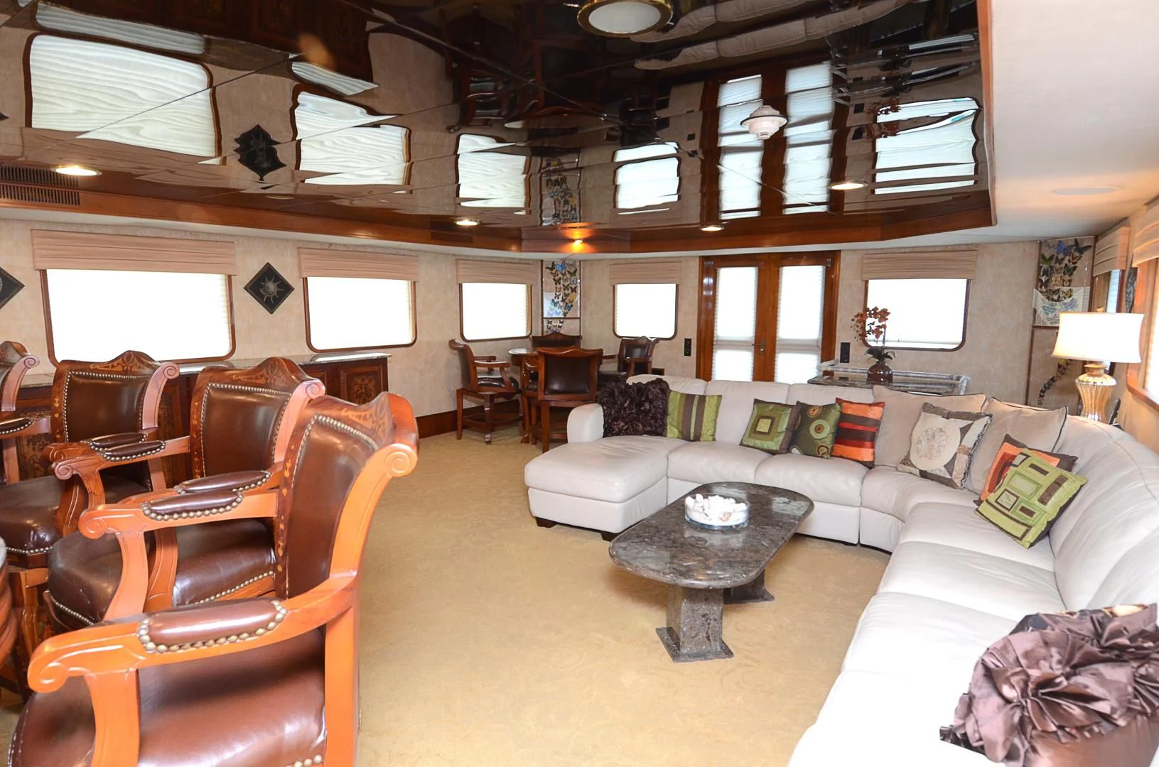 a living room with a couch and a coffee table aboard SHENANDOAH Yacht for Sale