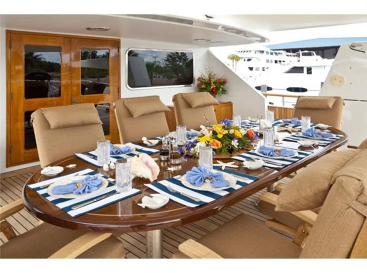 a dining table in a living room aboard SHENANDOAH Yacht for Sale