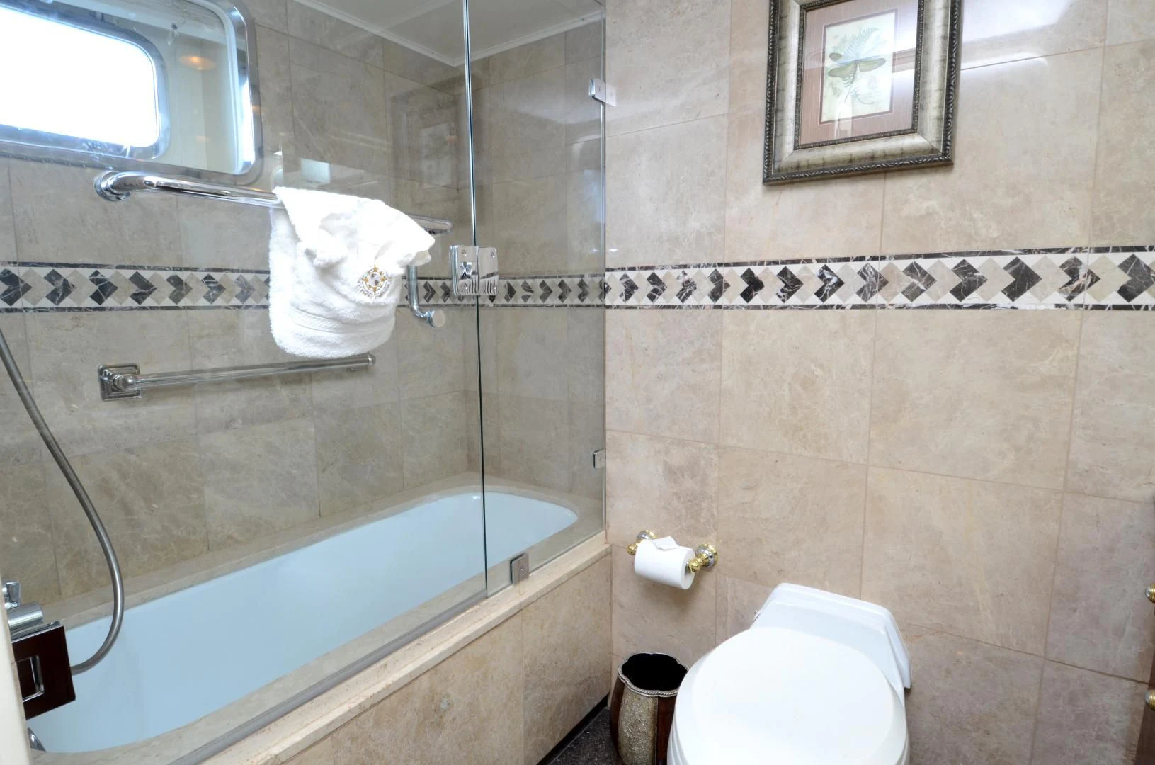 a bathroom with a bathtub and toilet aboard SHENANDOAH Yacht for Sale