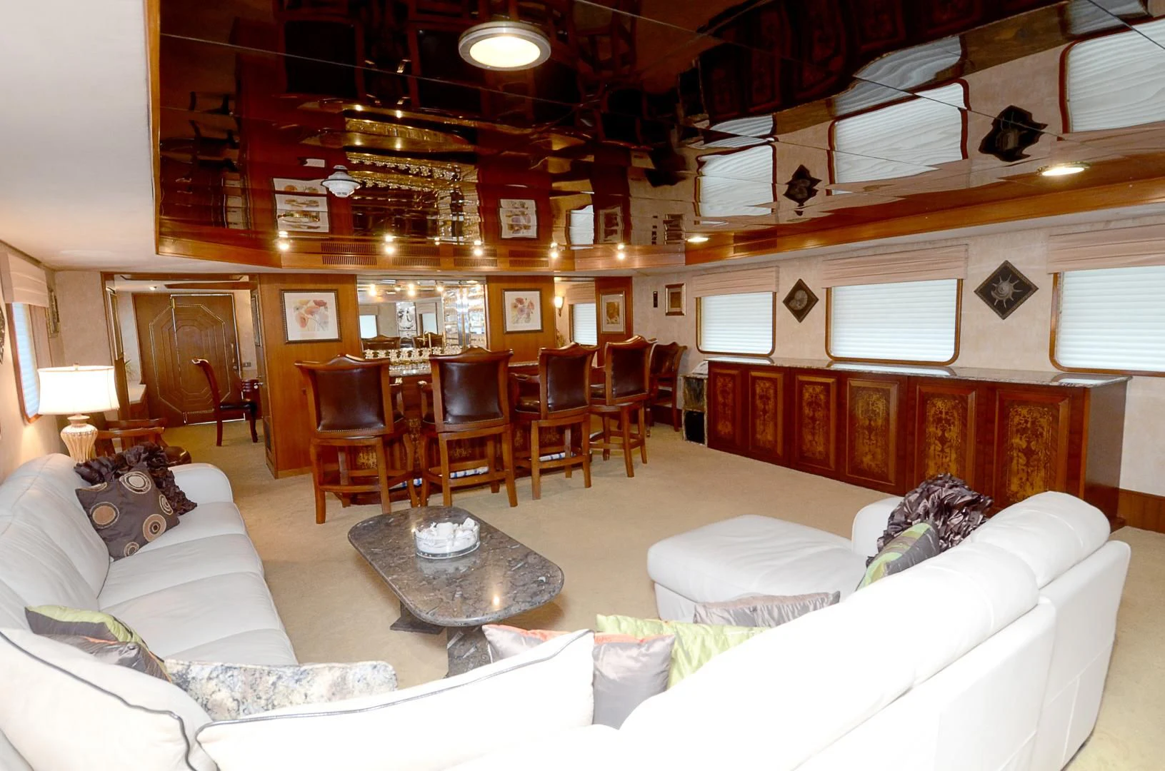 a large living room with a large fireplace aboard SHENANDOAH Yacht for Sale