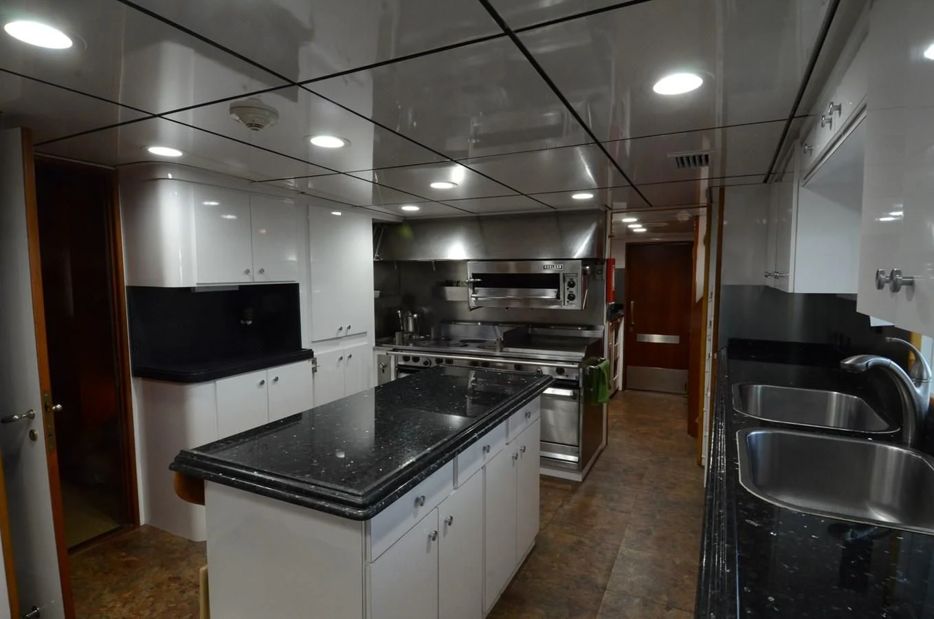 a kitchen with a large island aboard SHENANDOAH Yacht for Sale