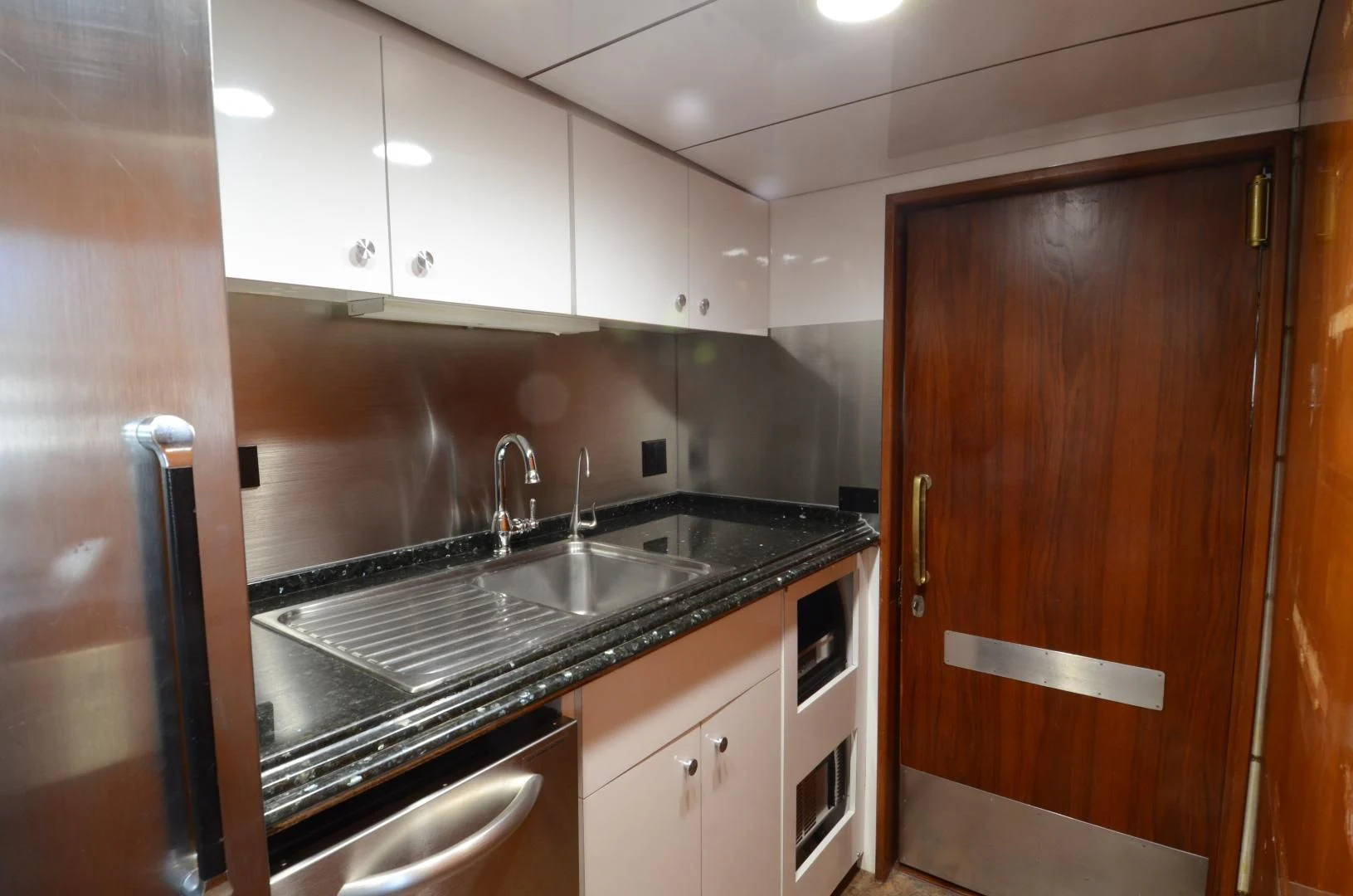 a kitchen with stainless steel appliances aboard SHENANDOAH Yacht for Sale