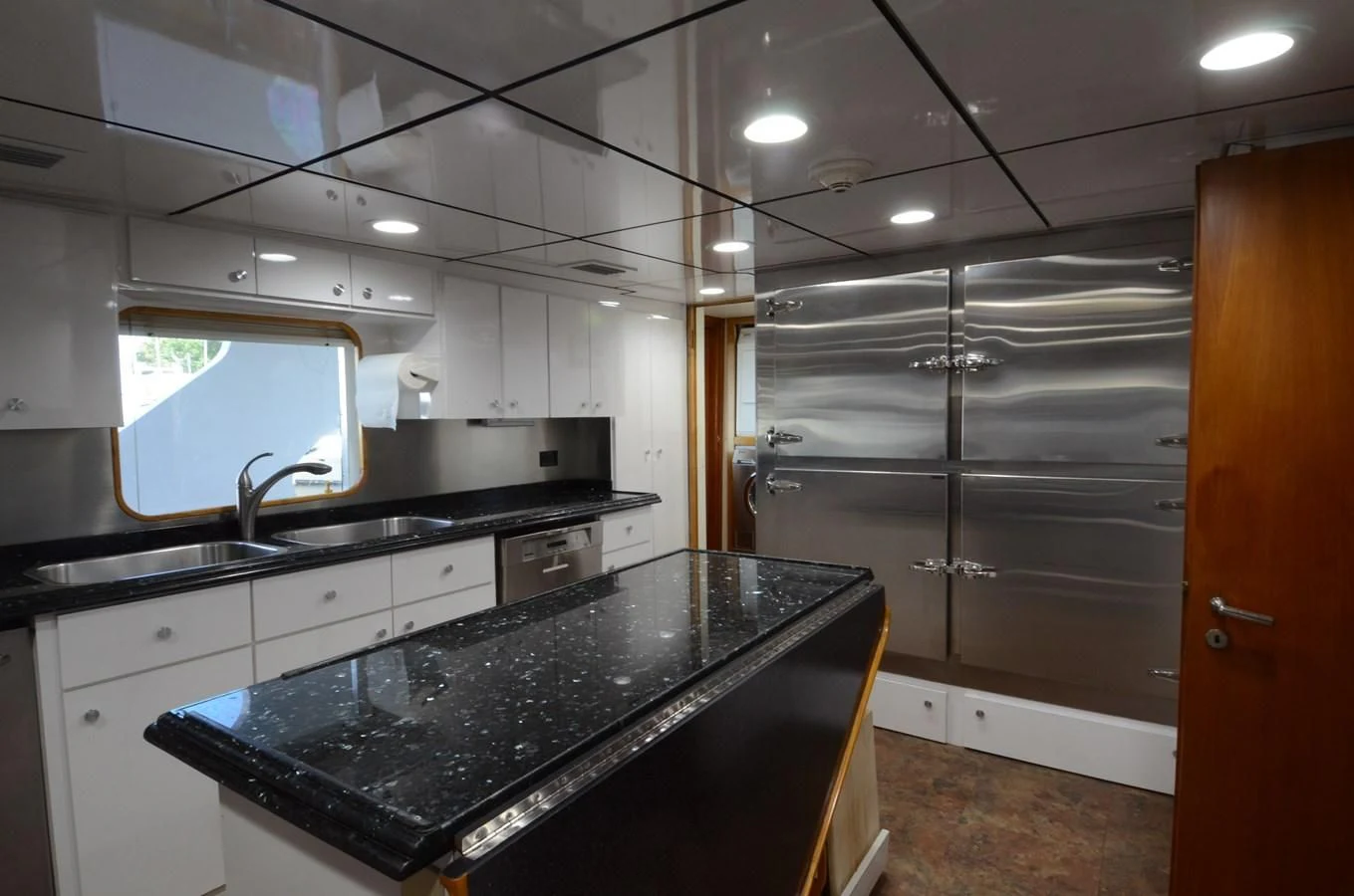 a kitchen with white cabinets aboard SHENANDOAH Yacht for Sale