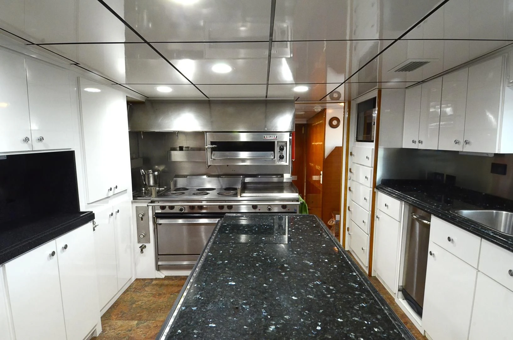 a kitchen with a black stove aboard SHENANDOAH Yacht for Sale