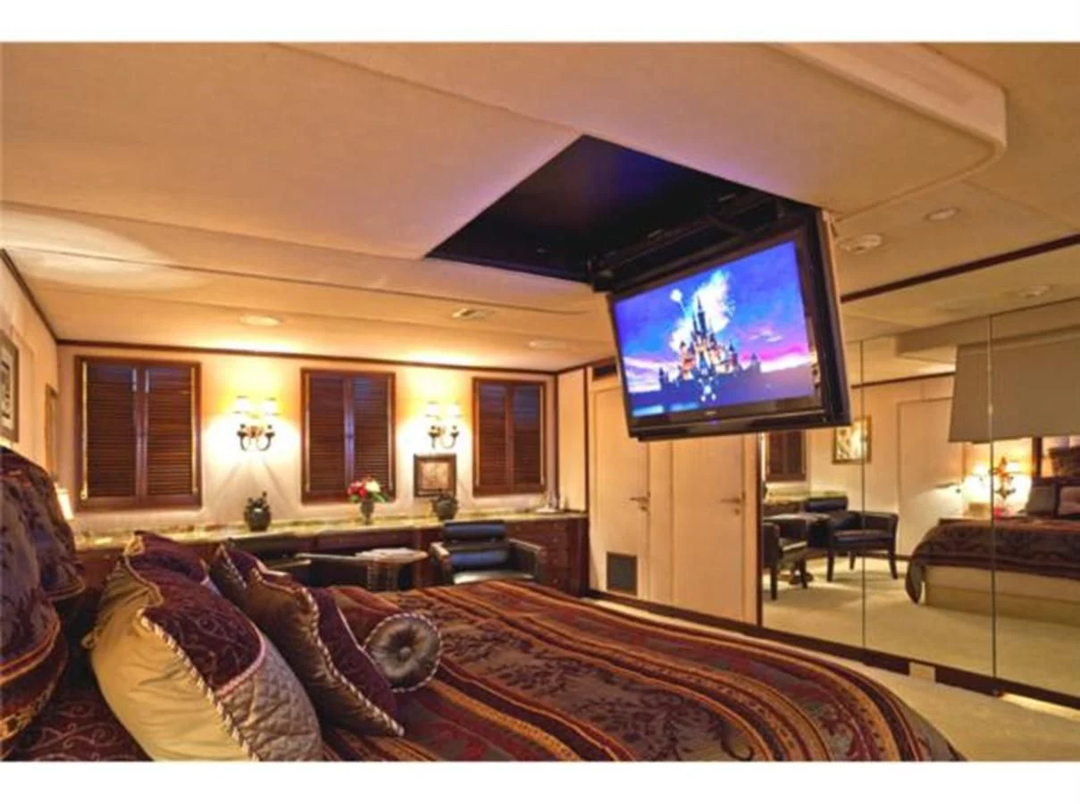 a living room with a large television aboard SHENANDOAH Yacht for Sale