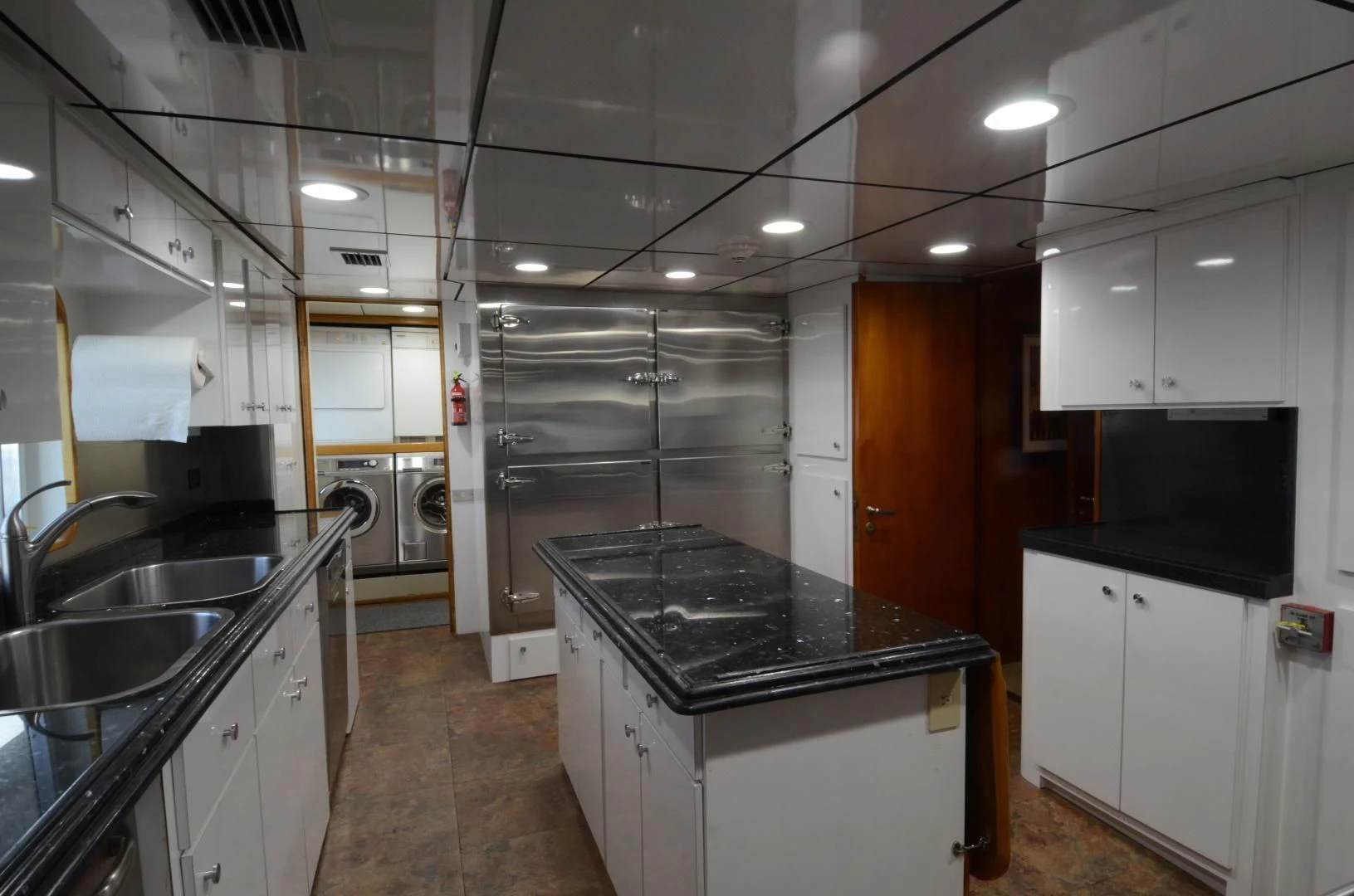 a kitchen with a black counter top aboard SHENANDOAH Yacht for Sale