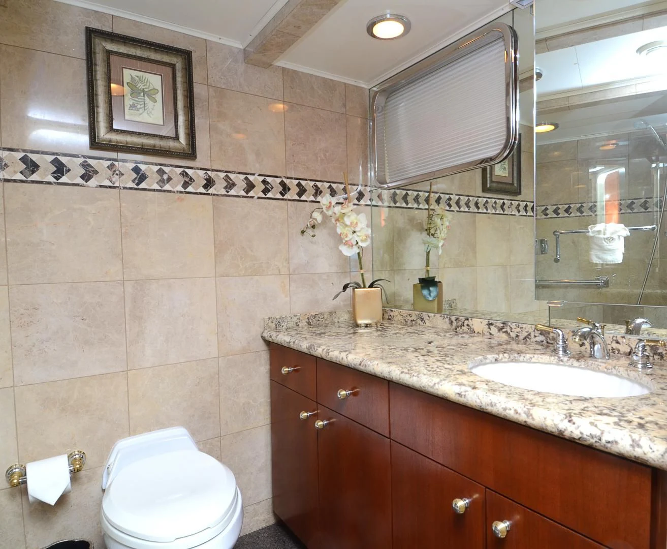 a bathroom with a toilet and a sink aboard SHENANDOAH Yacht for Sale