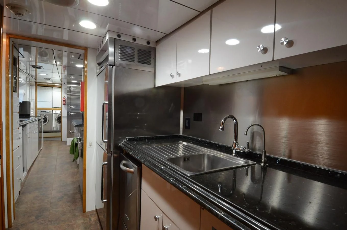 a kitchen with stainless steel appliances aboard SHENANDOAH Yacht for Sale