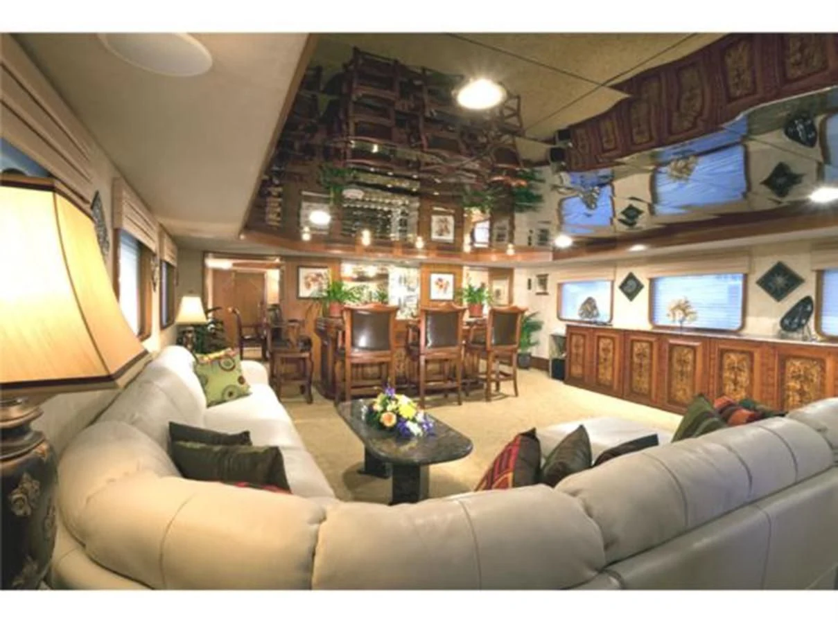 a living room with a couch and a table aboard SHENANDOAH Yacht for Sale