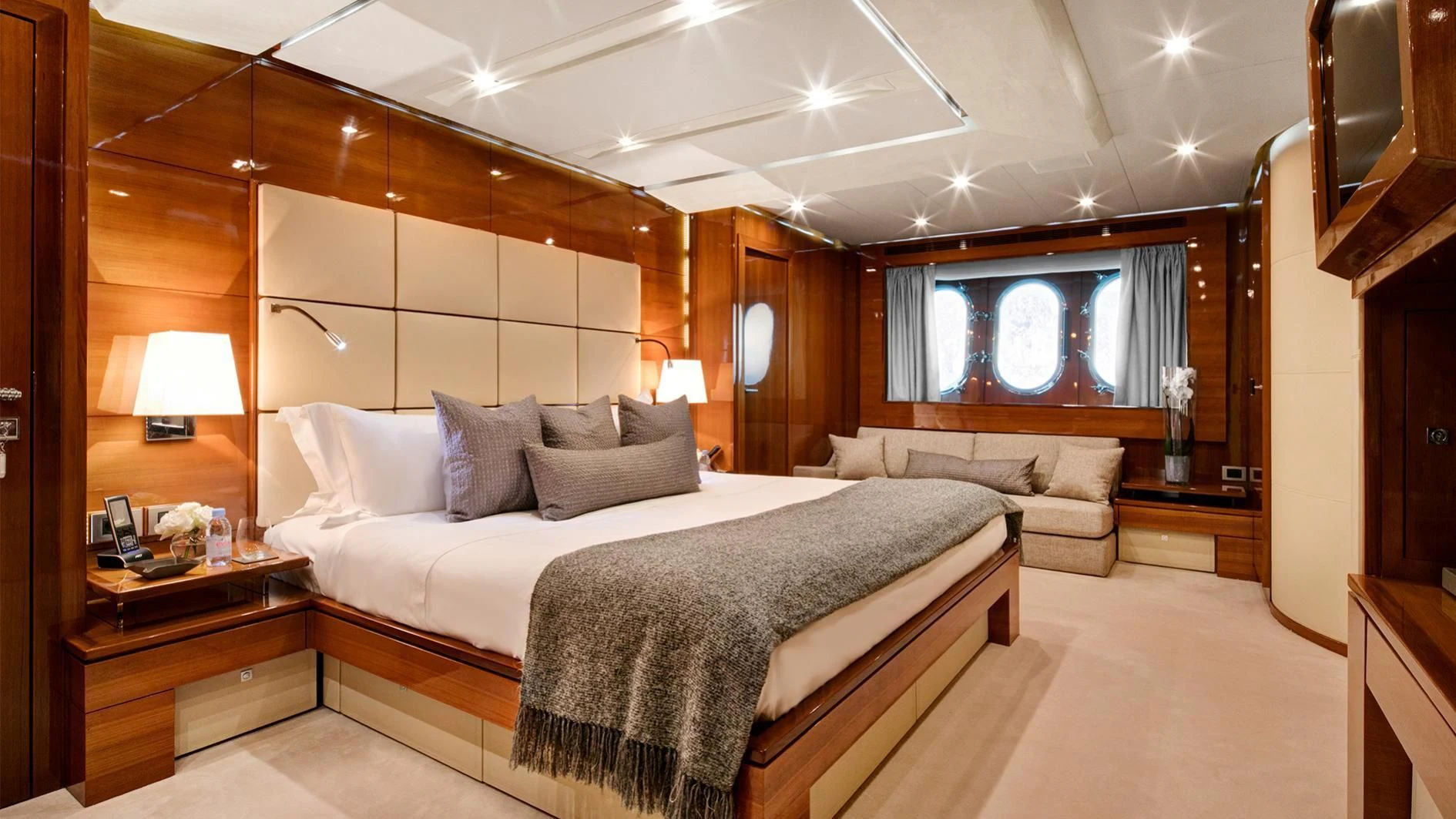 a large bedroom with a large bed aboard APMONIA Yacht for Sale