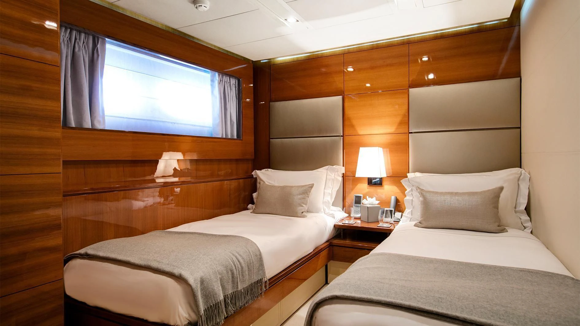 a room with two beds aboard APMONIA Yacht for Sale