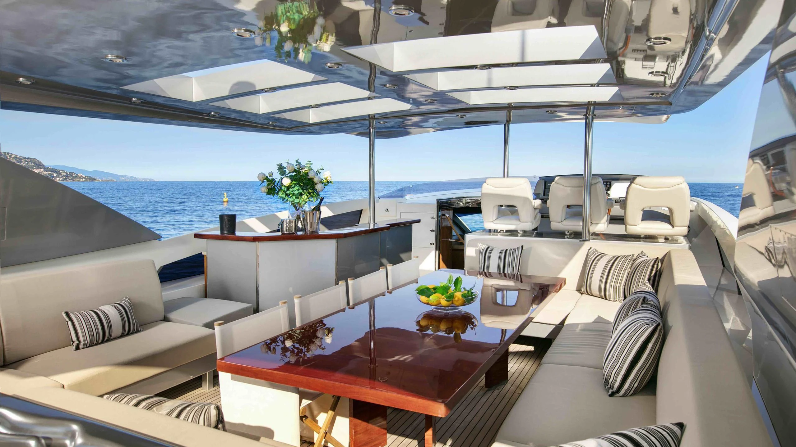 a room with a table and chairs aboard APMONIA Yacht for Sale