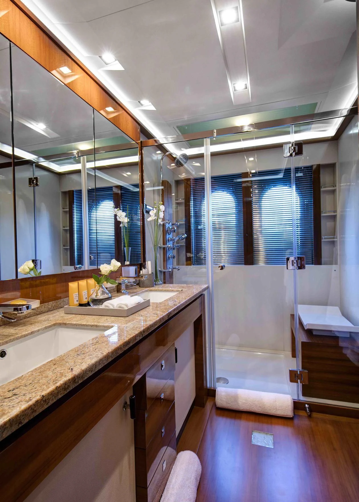 a bathroom with a large mirror aboard APMONIA Yacht for Sale